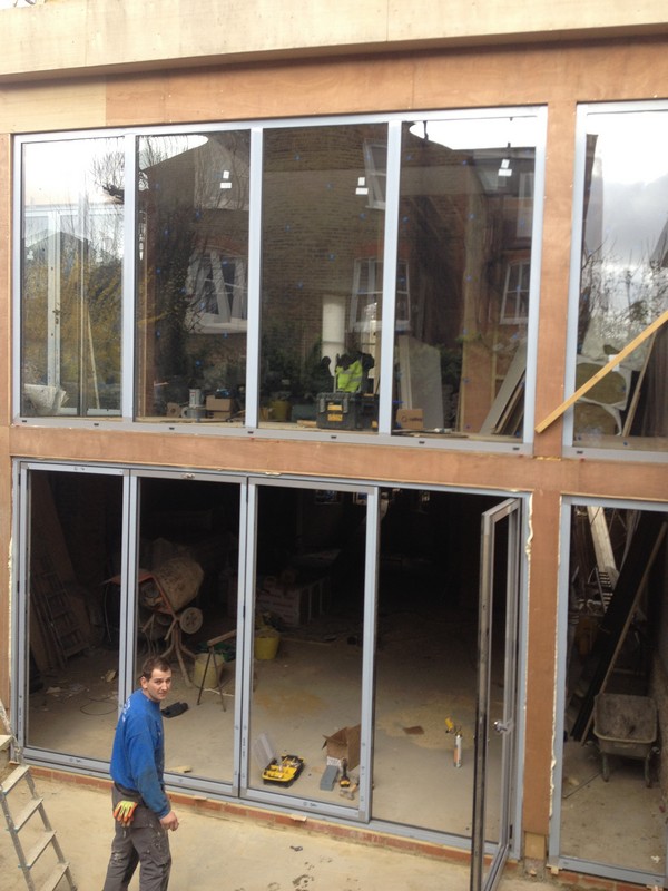 Aluminium bi-fold doors with two-storey glazing in East Finchley