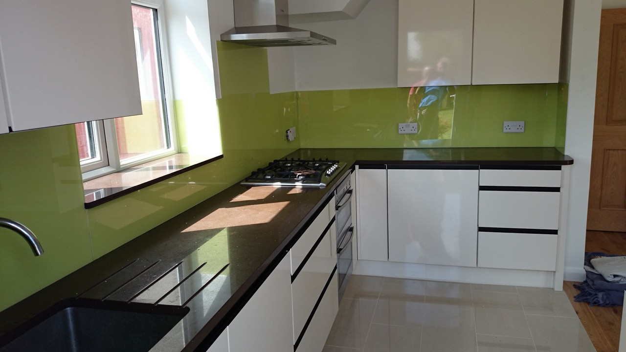 Lime green glass kitchen splashback installed by East Finchley glaziers